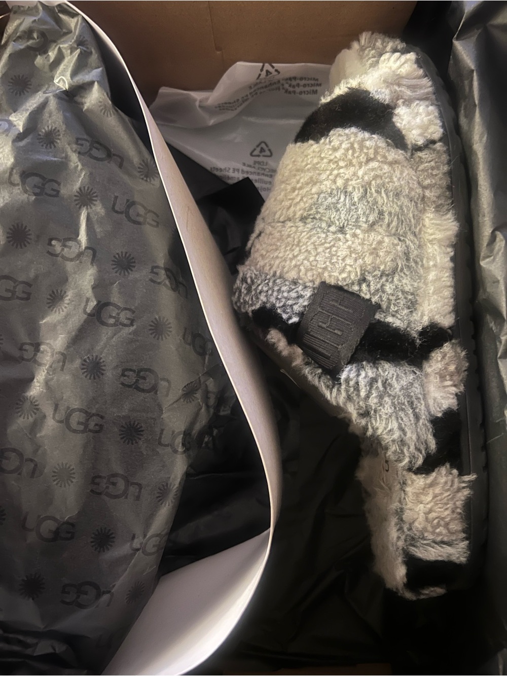 UGG Black and Cream Shearling Slide with Branded Tab